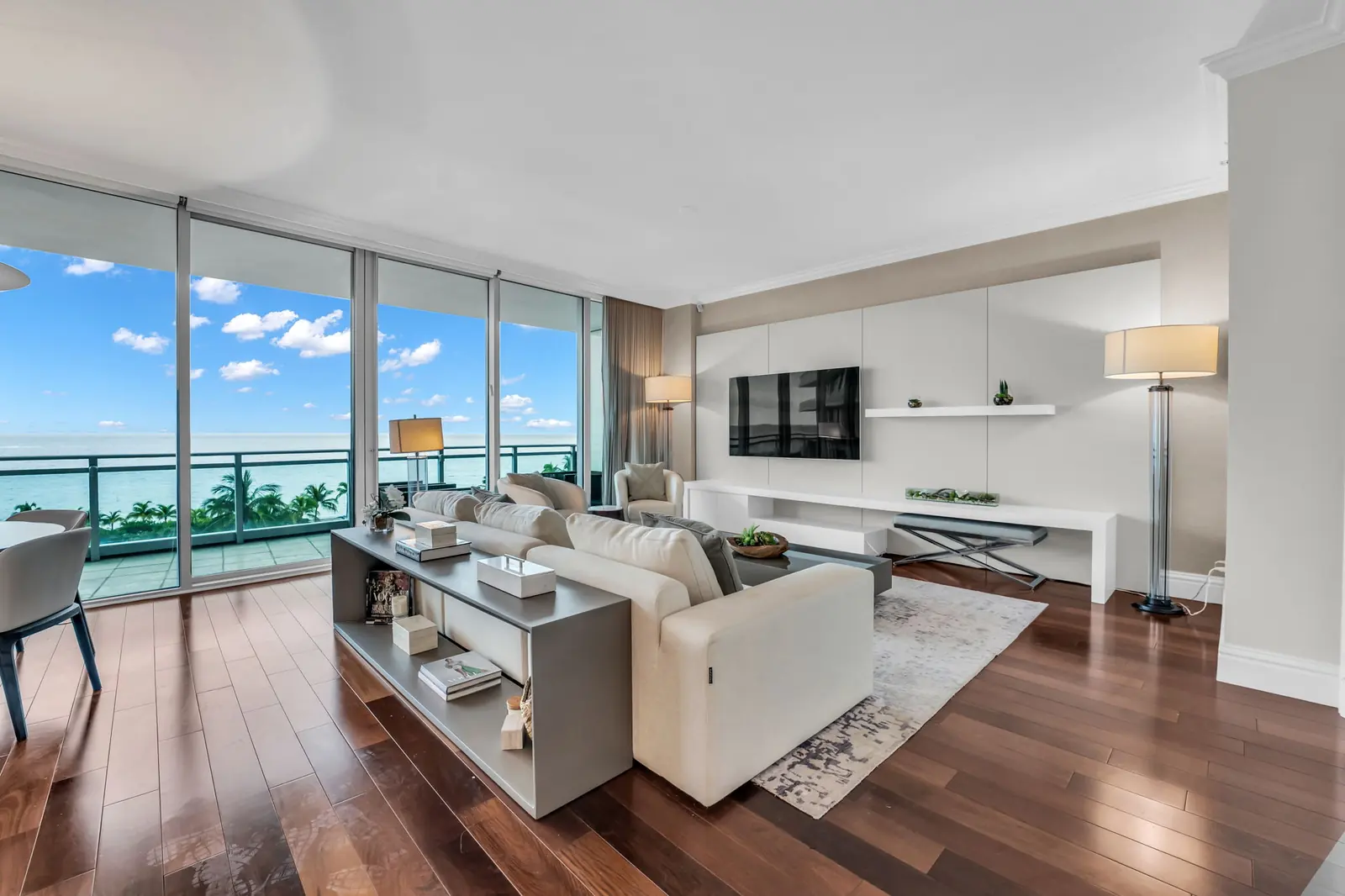Condo living room with floor-to-ceiling ocean views in Bal Harbour