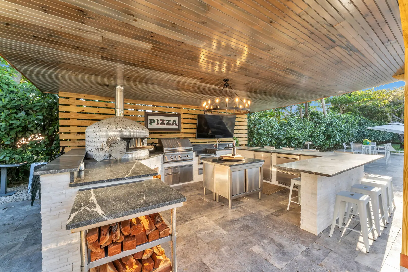 Outdoor kitchen with pizza oven in Delray Beach