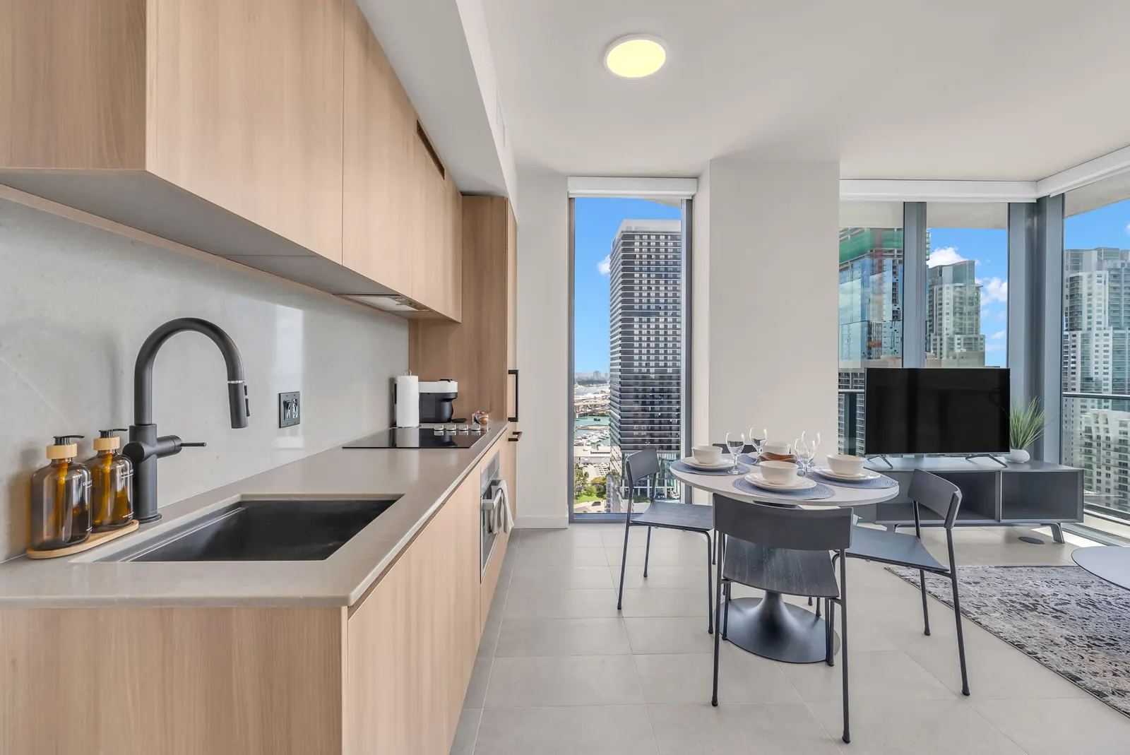 Condo kitchen with skyline view in downtown Miami