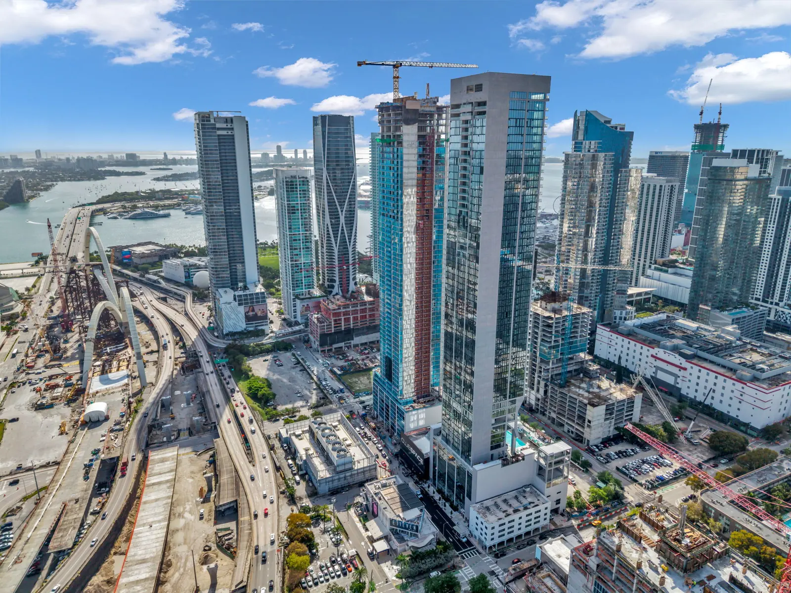 Drone aerial of downtown Miami towers and Biscayne Bay
