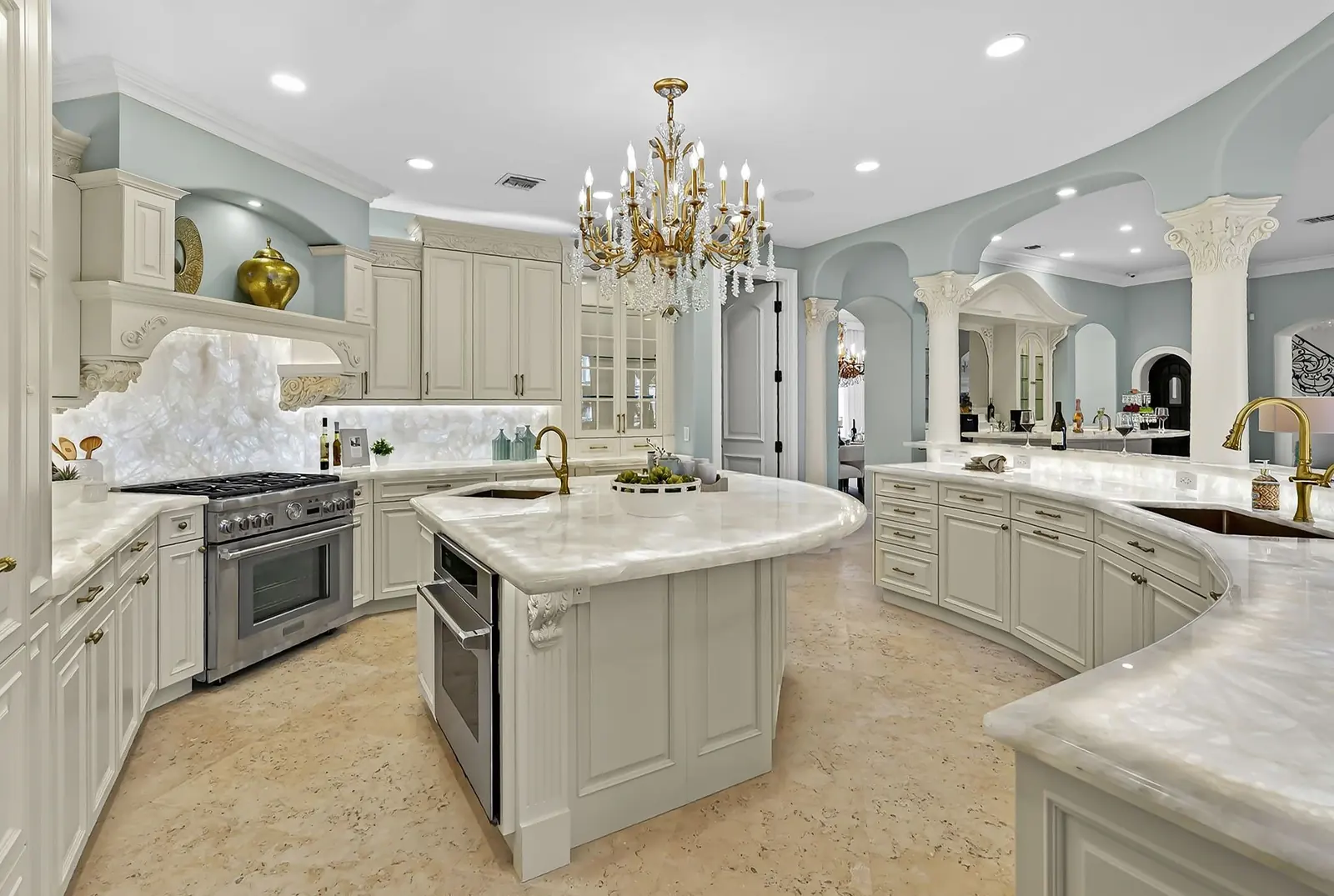 Luxury kitchen with marble island and chandelier in Fort Lauderdale