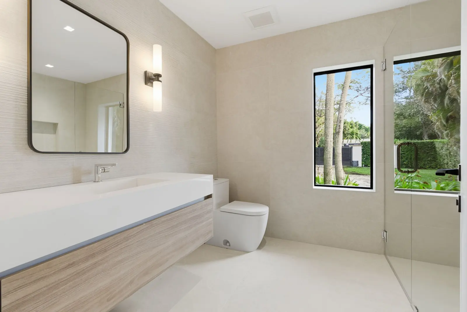 Modern bathroom with garden window in Miami