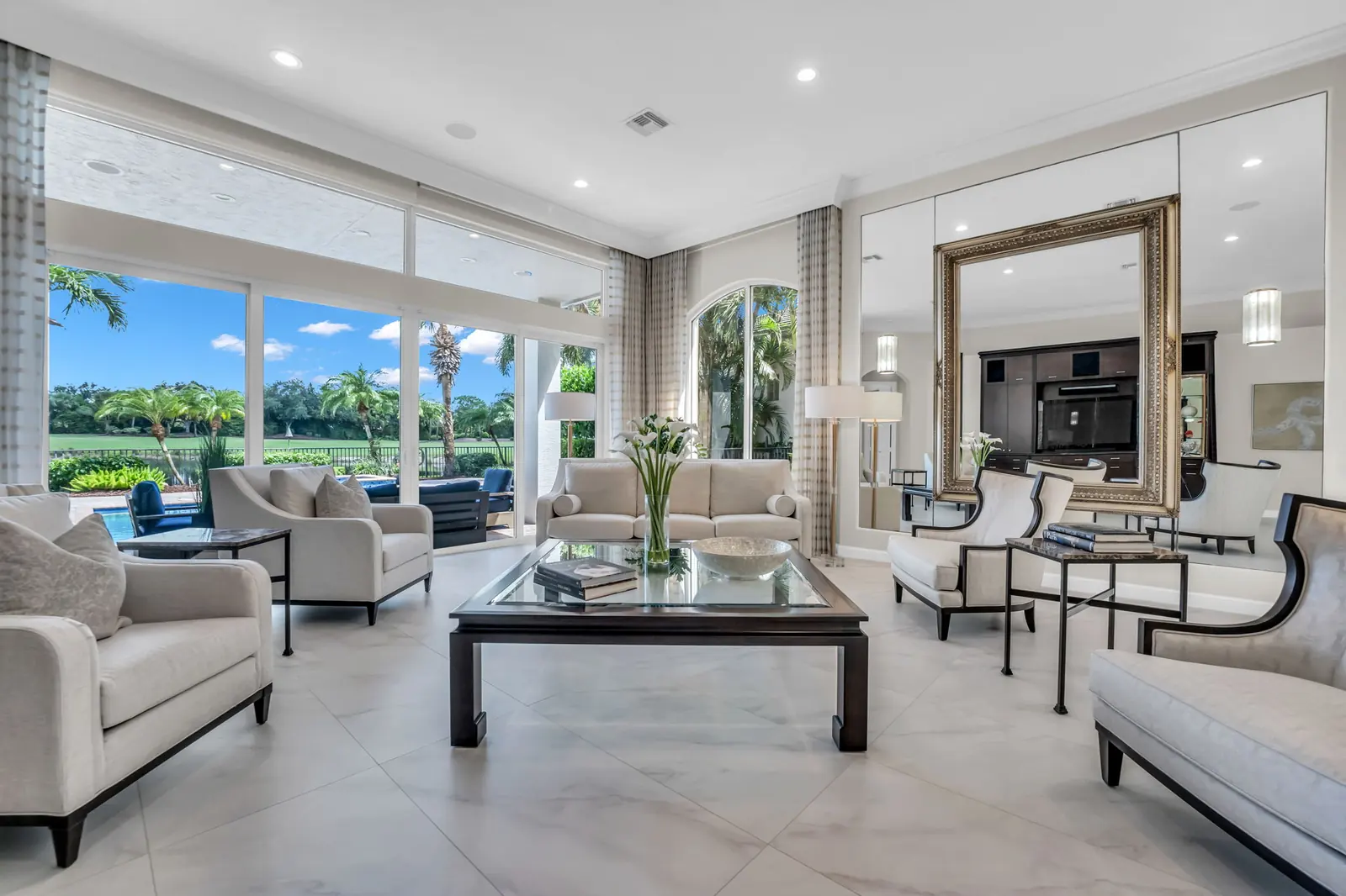 Living room with pool and golf view in Palm Beach Gardens