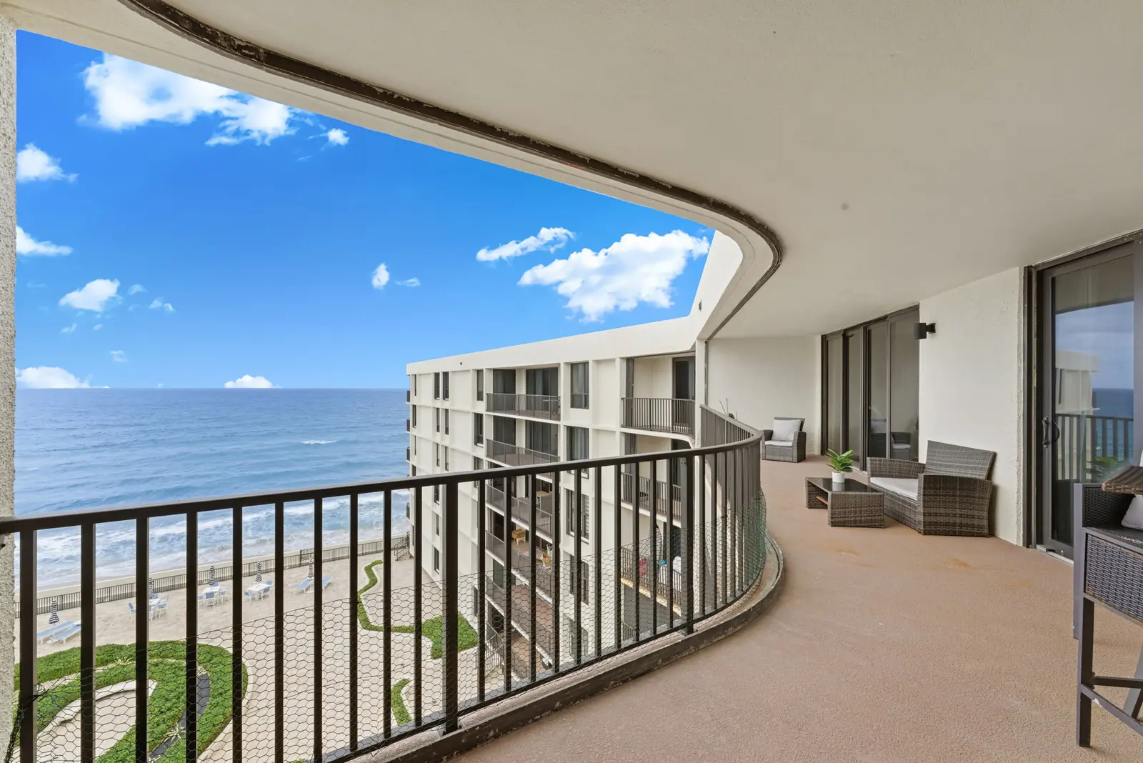 Curved balcony over the beach and ocean in South Palm Beach