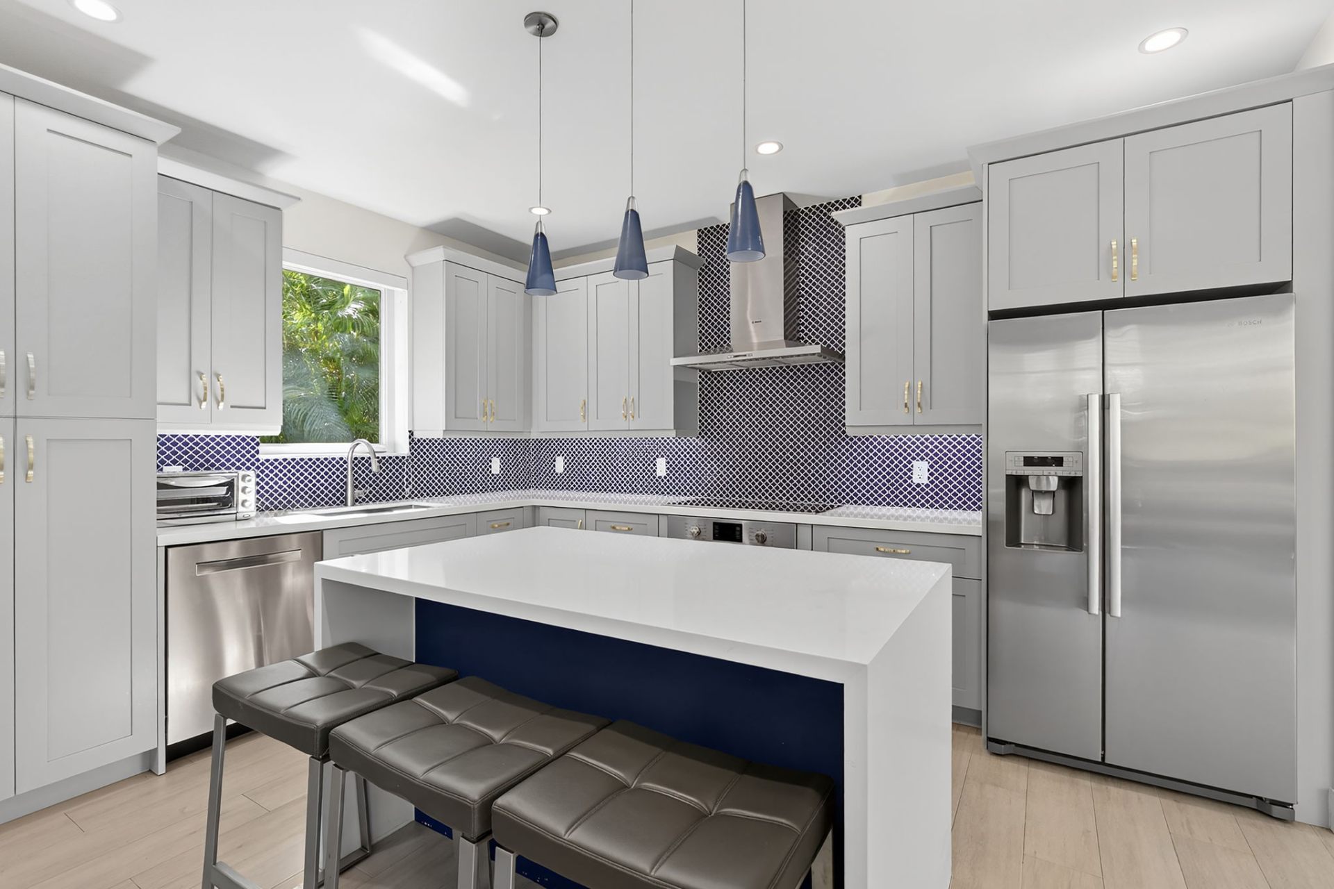 Designer Kitchen with Navy Island - Featured Real Estate Photography by Estate Shutter